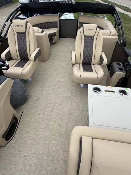 Slide: The Image of Luxurious interior of 2025 Harris Sunliner 230 pontoon boat with beige seating and modern design. - 9