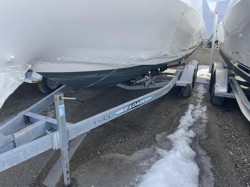Slide: The Image of 1998 Wellcraft 23 Walkaround boat on EZ Loader trailer, parked on snowy ground. - 3