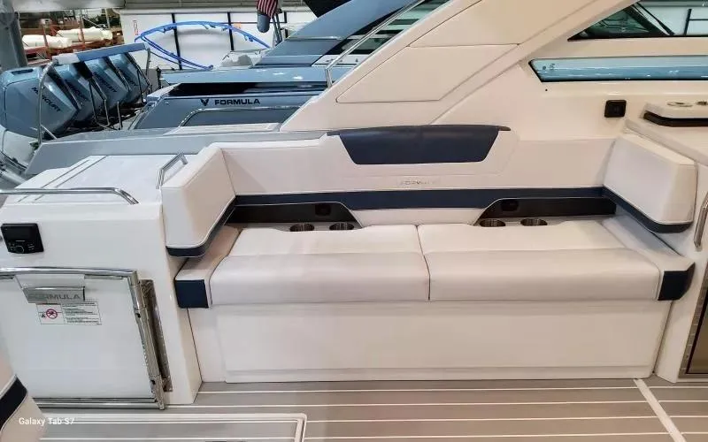 Slide: The Image of 2025 Formula 400 Super Sport Crossover boat interior with sleek seating and modern design. - 12