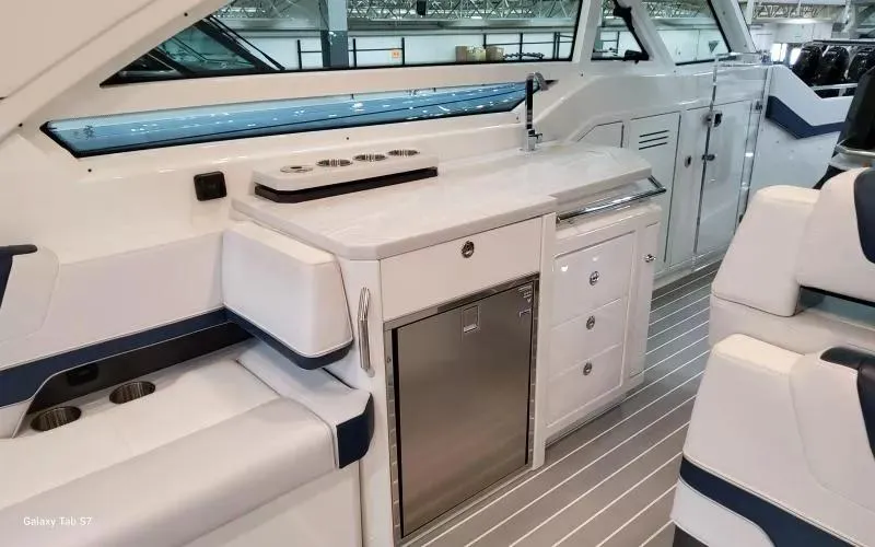 Slide: The Image of 2025 Formula 400 Super Sport Crossover yacht interior with sleek kitchen and modern design. - 14