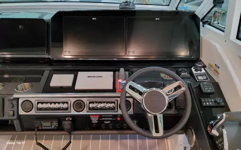 Slide: The Image of 2025 Formula 400 Super Sport Crossover dashboard with advanced controls and navigation displays. - 18