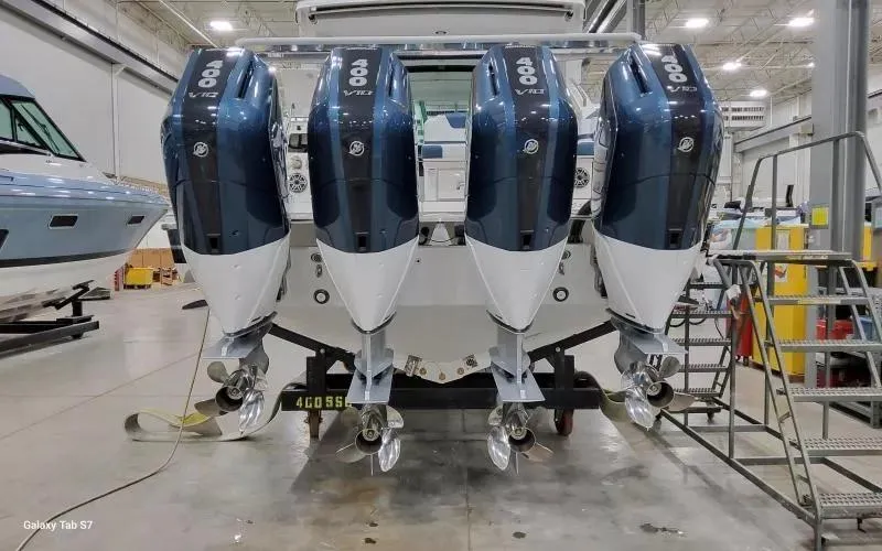 Slide: The Image of 2025 Formula 400 Super Sport Crossover with quad outboard engines in a showroom. - 3