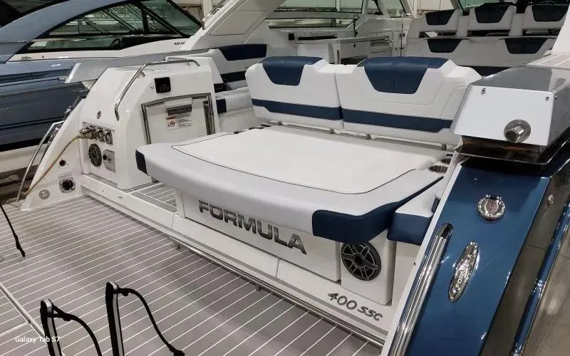 Slide: The Image of 2025 Formula 400 Super Sport Crossover boat with luxurious seating and sleek design. - 7
