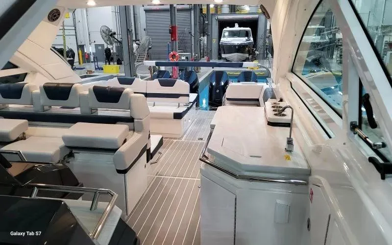 Slide: The Image of 2025 Formula 400 Super Sport Crossover interior with luxurious seating and modern amenities. - 9