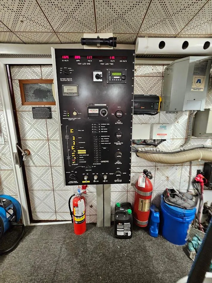 Slide: The Image of Electrical control panel in a 1987 DeFever 53 POC yacht engine room. - 21