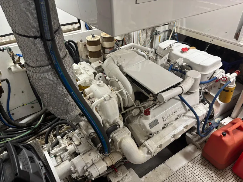 Slide: The Image of Engine room of a 1987 DeFever 53 POC yacht, showcasing mechanical components. - 26