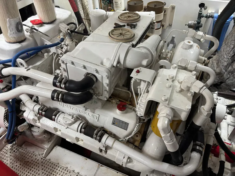 Slide: The Image of Man working in engine room of 1987 DeFever 53 POC yacht. - 27