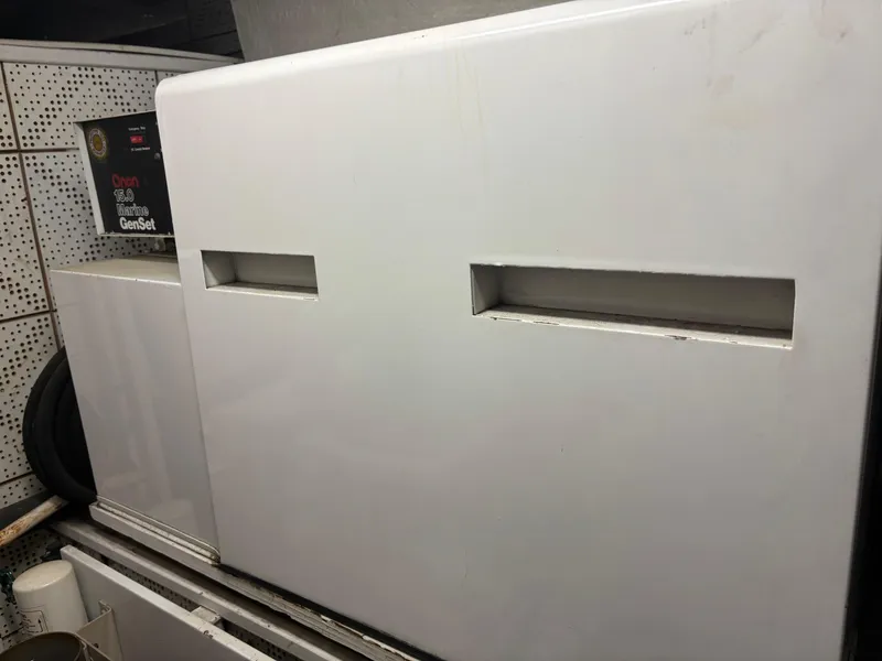 Slide: The Image of Interior of 1987 DeFever 53 POC yacht with spacious seating and large windows. - 33