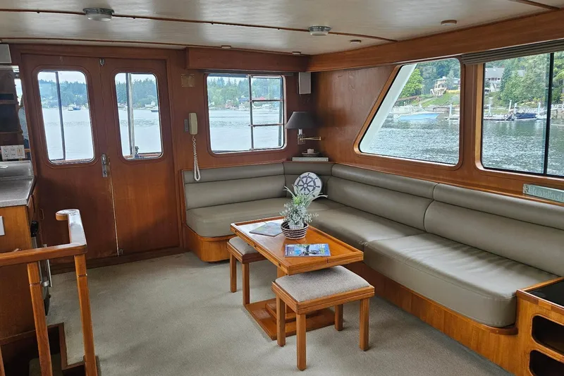 Slide: The Image of Interior of 1987 DeFever 53 POC yacht with bar stools and kitchen area. - 38