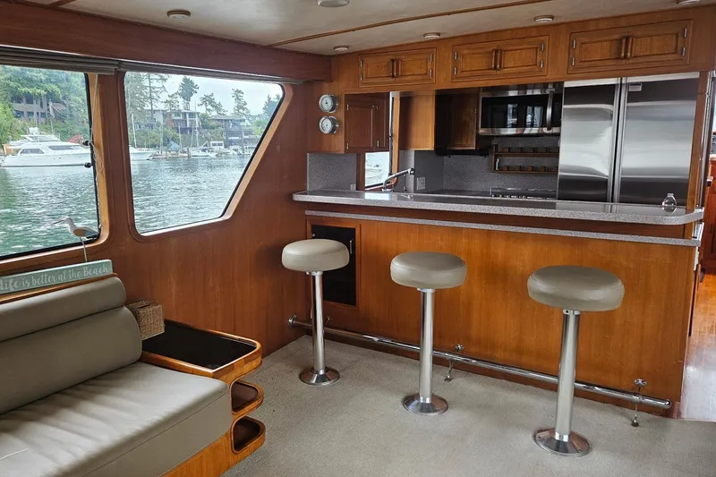 Slide: The Image of Interior of 1987 DeFever 53 POC yacht with kitchen sink and scenic window view. - 41