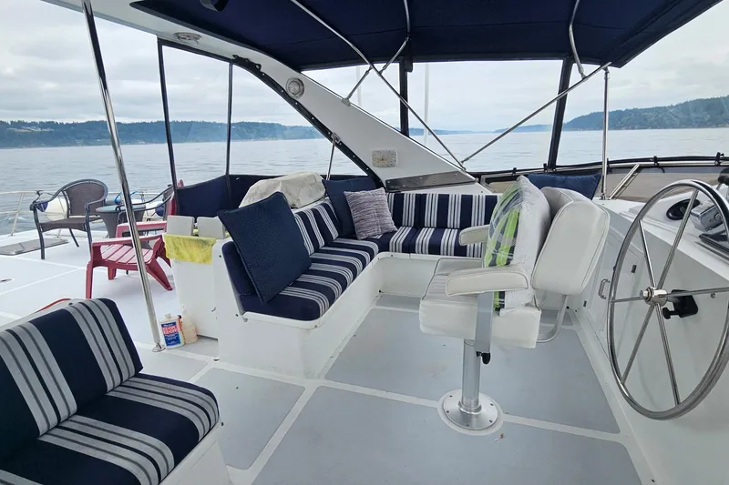 Slide: The Image of 1987 DeFever 53 POC yacht docked at marina under cloudy skies. - 5