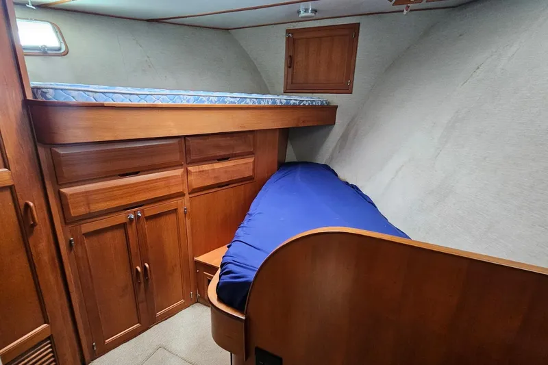 Slide: The Image of Wooden interior of 1987 DeFever 53 POC yacht, featuring louvered closet doors. - 51