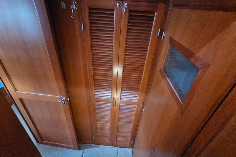 Slide: The Image of Wooden staircase inside 1987 DeFever 53 POC yacht, leading to upper deck. - 54
