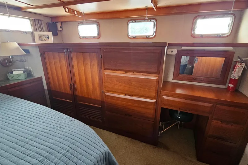 Slide: The Image of Bathroom interior of 1987 DeFever 53 POC yacht with sink, mirror, and toilet. - 64