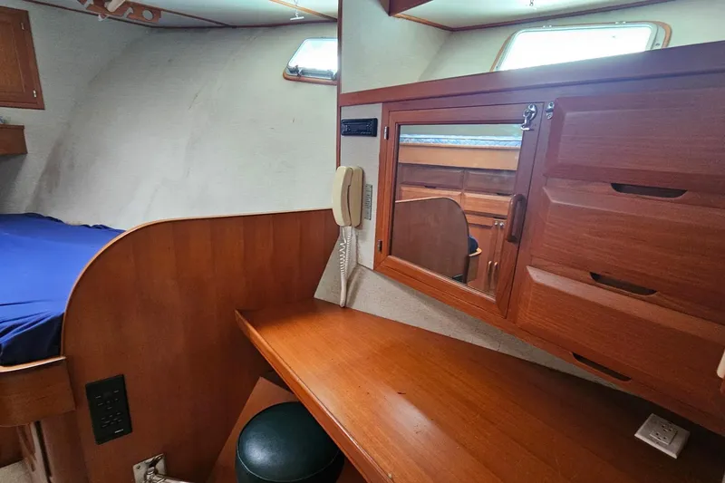 Slide: The Image of Interior of 1987 DeFever 53 POC yacht with wooden cabinetry and cozy bedroom. - 65