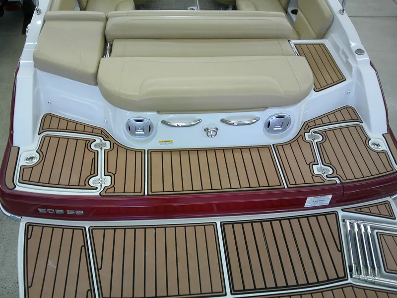 Slide: The Image of 2018 Crownline 205 SS boat with tan seating and teak-style decking. - 17