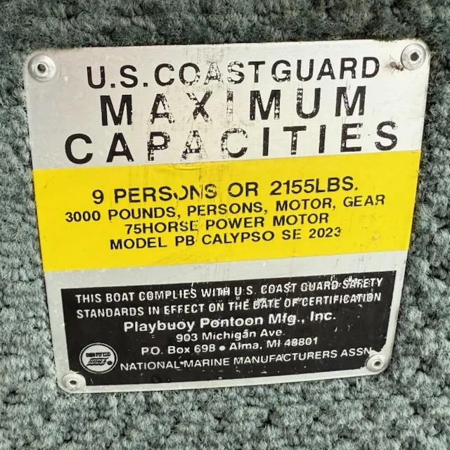 Slide: The Image of U.S. Coast Guard capacity plate for Playbuoy PB Calypso SE 2023, 9 persons or 2155 lbs. - 13