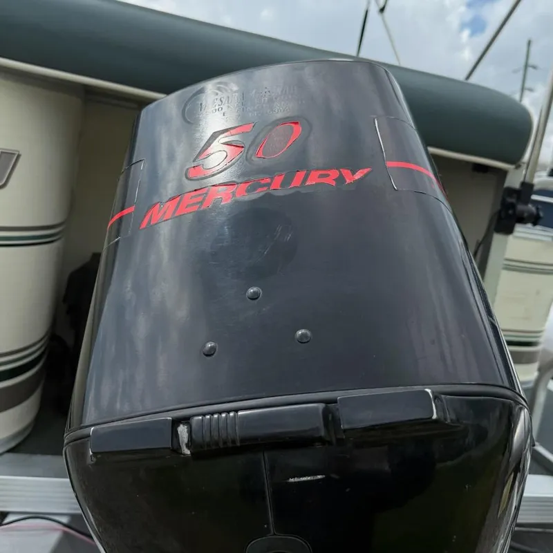 Slide: The Image of Outboard motor on Playbuoy PB Calypso SE 2023, featuring Mercury 50 branding. - 6