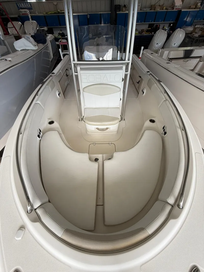 Slide: The Image of 2015 Robalo R222 Center Console boat interior with spacious seating and sleek design. - 11