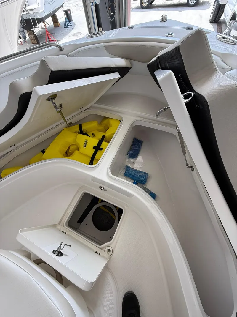 Slide: The Image of 2015 Robalo R222 Center Console boat interior with open storage compartments. - 9