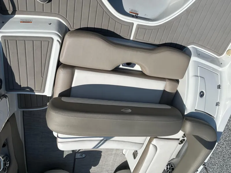 Slide: The Image of 2021 Crownline Eclipse E215 XS boat interior with gray seating and flooring. - 13
