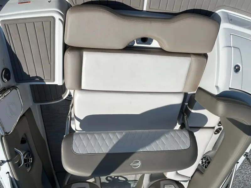 Slide: The Image of 2021 Crownline Eclipse E215 XS boat seating with gray and white upholstery. - 14