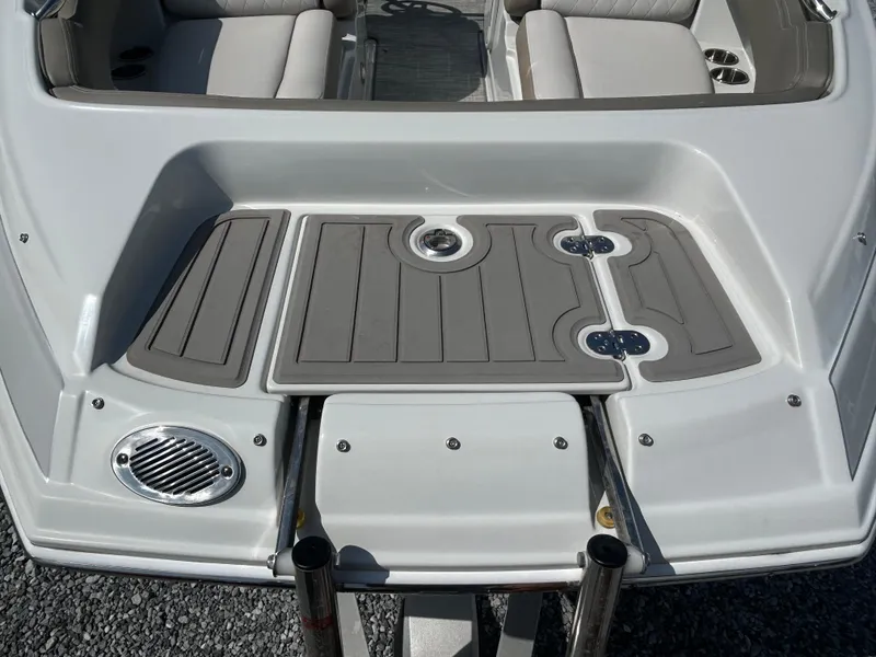 Slide: The Image of 2021 Crownline Eclipse E215 XS boat deck with seating and swim platform. - 8