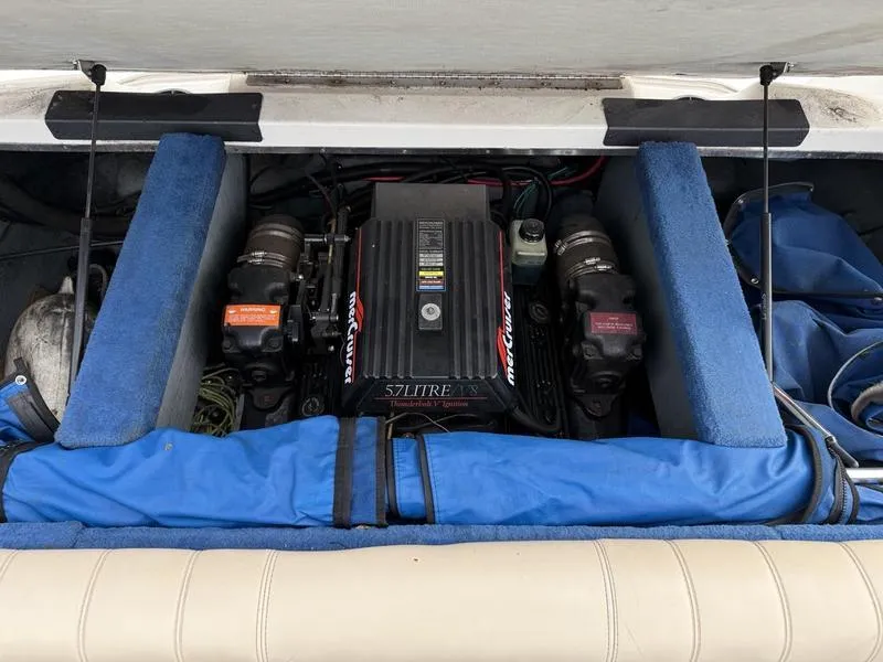 Slide: The Image of Engine compartment of a 1996 Sea Ray 210 Signature boat with a 5.7L engine. - 11