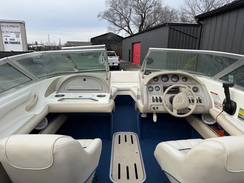 Slide: The Image of 1996 Sea Ray 210 Signature boat interior with dual consoles and steering wheel. - 8