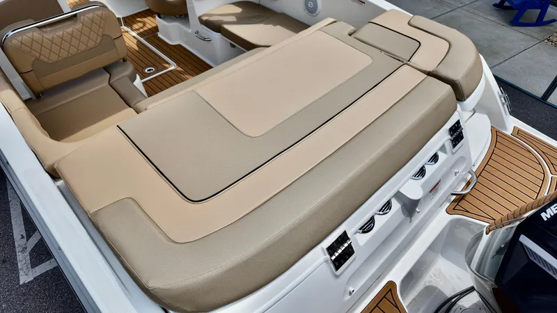 Slide: The Image of 2025 Bayliner VR6 boat with beige seating and modern design. - 11