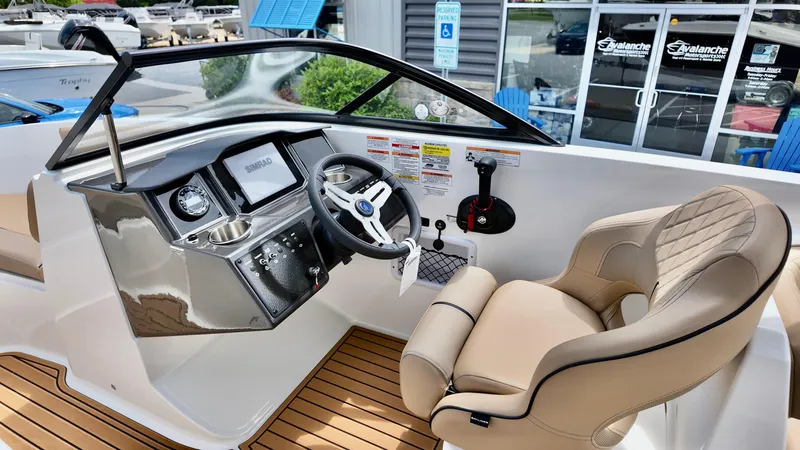 Slide: The Image of 2025 Bayliner VR6 boat cockpit with modern steering and comfortable seating. - 5