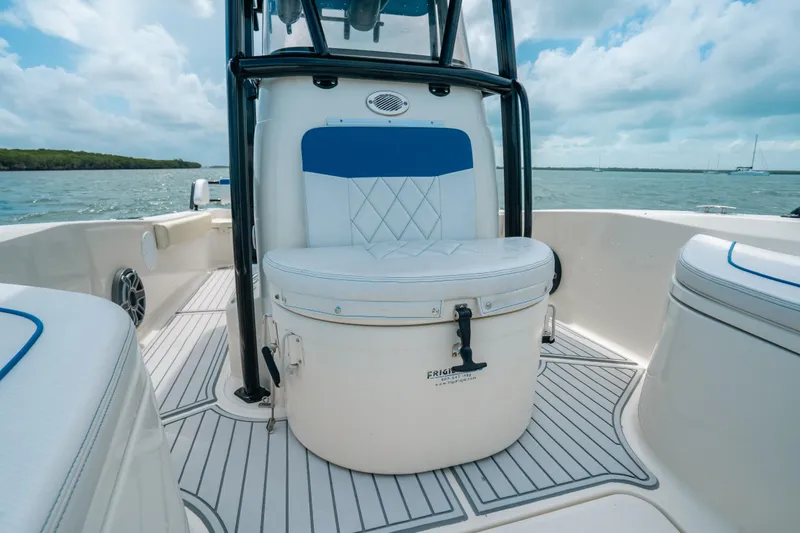Slide: The Image of 2015 Hydra-Sports 23 Bay boat interior with cushioned seating and ocean view. - 10