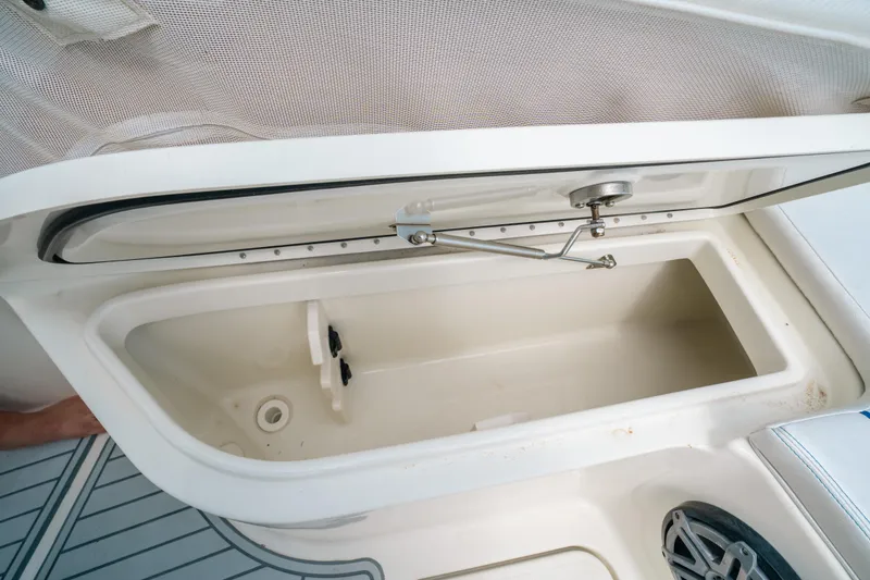 Slide: The Image of Open storage compartment on a 2015 Hydra-Sports 23 Bay boat. - 13