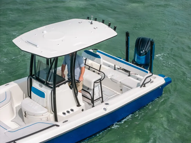 Slide: The Image of 2015 Hydra-Sports 23 Bay boat on water, featuring a sleek design and spacious deck. - 14