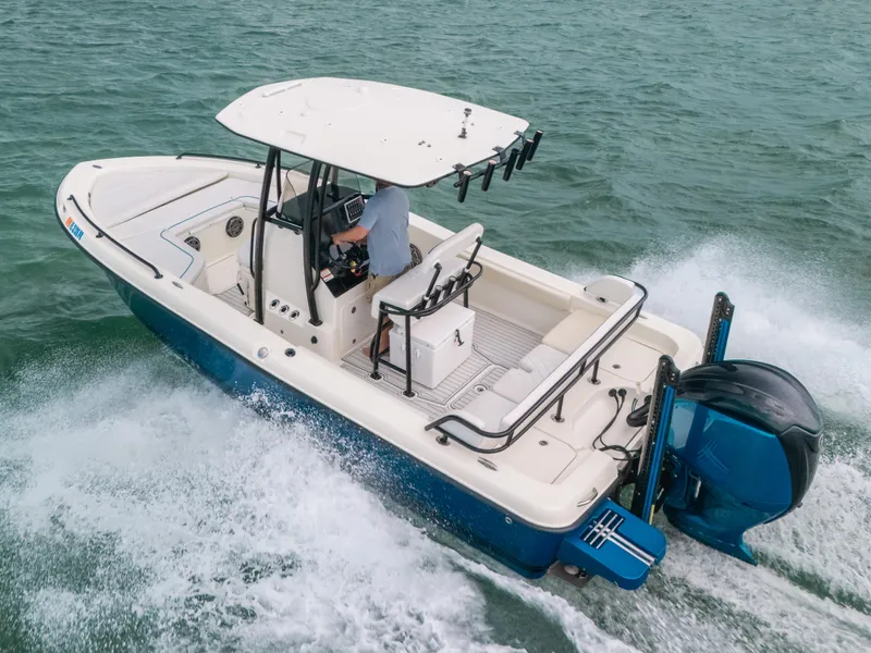 Slide: The Image of 2015 Hydra-Sports 23 Bay boat cruising on open water, featuring a sleek design and powerful engine. - 15