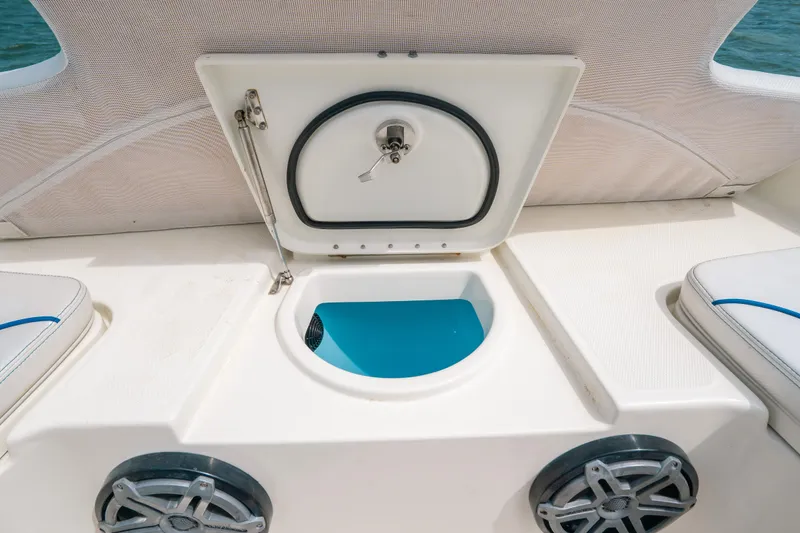 Slide: The Image of 2015 Hydra-Sports 23 Bay boat storage compartment with open hatch and speakers. - 20