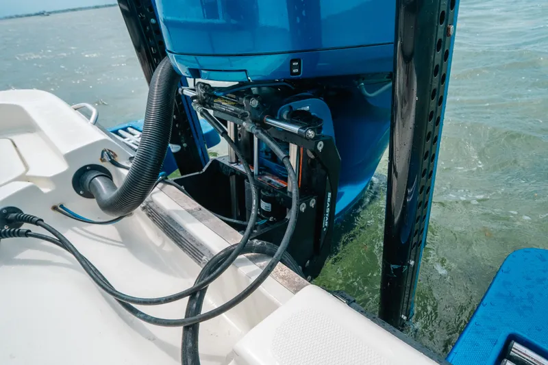 Slide: The Image of 2015 Hydra-Sports 23 Bay boat engine detail in water, showcasing hydraulic components. - 23