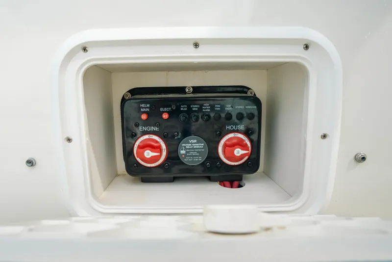 Slide: The Image of 2015 Hydra-Sports 23 Bay boat battery switch panel in a compartment. - 27