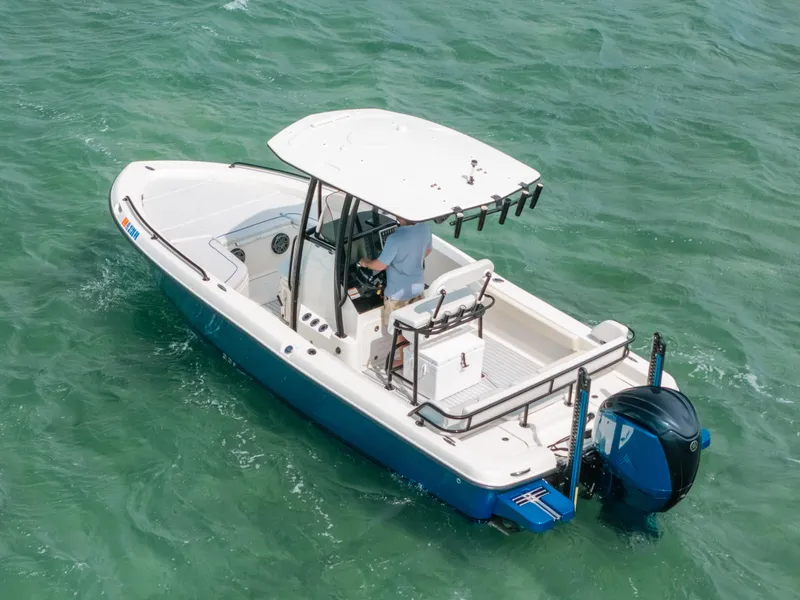 Slide: The Image of 2015 Hydra-Sports 23 Bay boat cruising on clear turquoise water. - 32