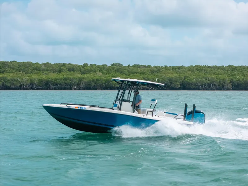 Slide: The Image of 2015 Hydra-Sports 23 Bay boat cruising on open water. - 35