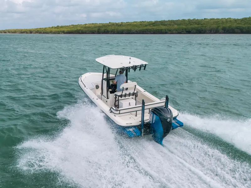 Slide: The Image of 2015 Hydra-Sports 23 Bay boat cruising on open water. - 36