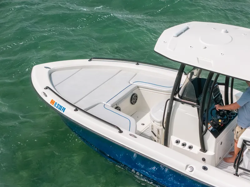 Slide: The Image of 2015 Hydra-Sports 23 Bay boat on clear green water, featuring sleek design and modern controls. - 5