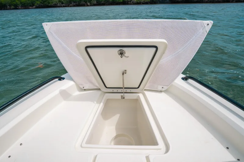 Slide: The Image of 2015 Hydra-Sports 23 Bay boat with open storage compartment on deck. - 8