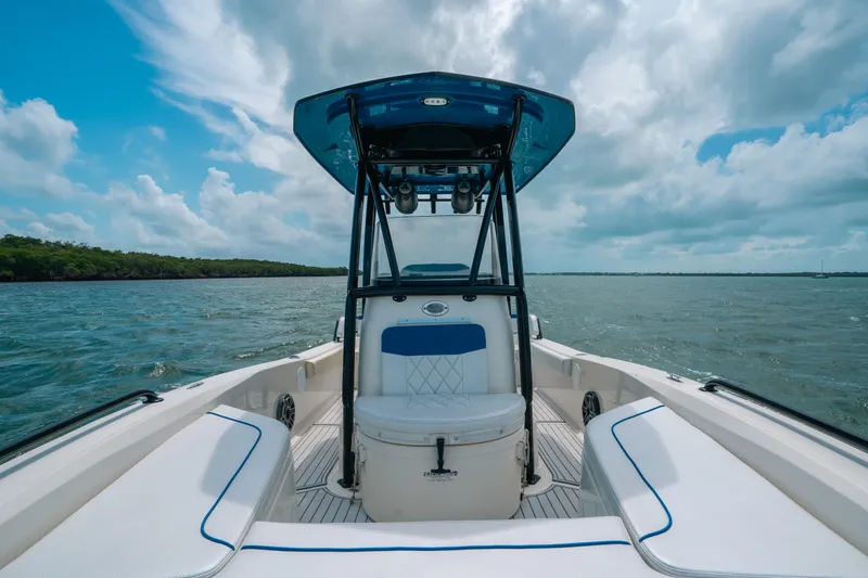 Slide: The Image of 2015 Hydra-Sports 23 Bay boat on open water under a cloudy sky. - 9