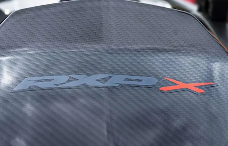 Slide: The Image of 2024 Sea-Doo RXP-X 325 logo on carbon fiber surface. - 6