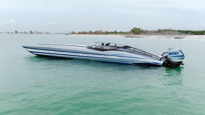 Slide: The Image of 2024 MTI 440X speedboat on calm water, featuring sleek design and powerful engine. - 14
