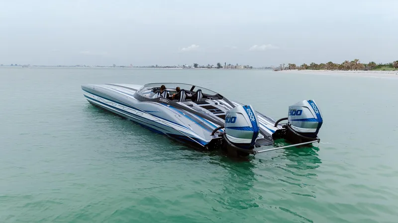Slide: The Image of 2024 MTI 440X speedboat with dual outboard engines on calm water. - 15
