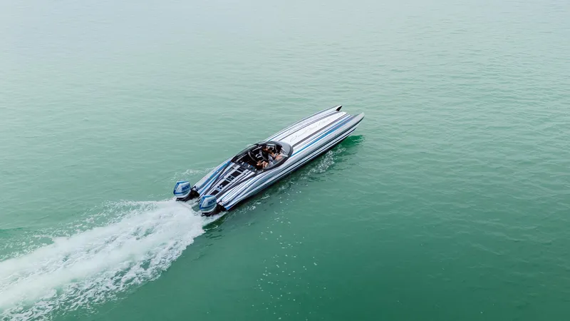 Slide: The Image of Aerial view of 2024 MTI 440X speedboat cruising on open water. - 17
