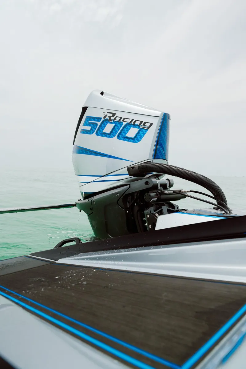 Slide: The Image of 2024 MTI 440X boat with Racing 500 engine on calm water. - 22