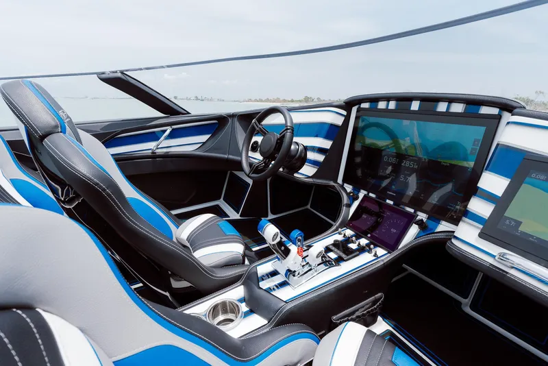 Slide: The Image of 2024 MTI 440X boat interior with modern dashboard and blue accents. - 25